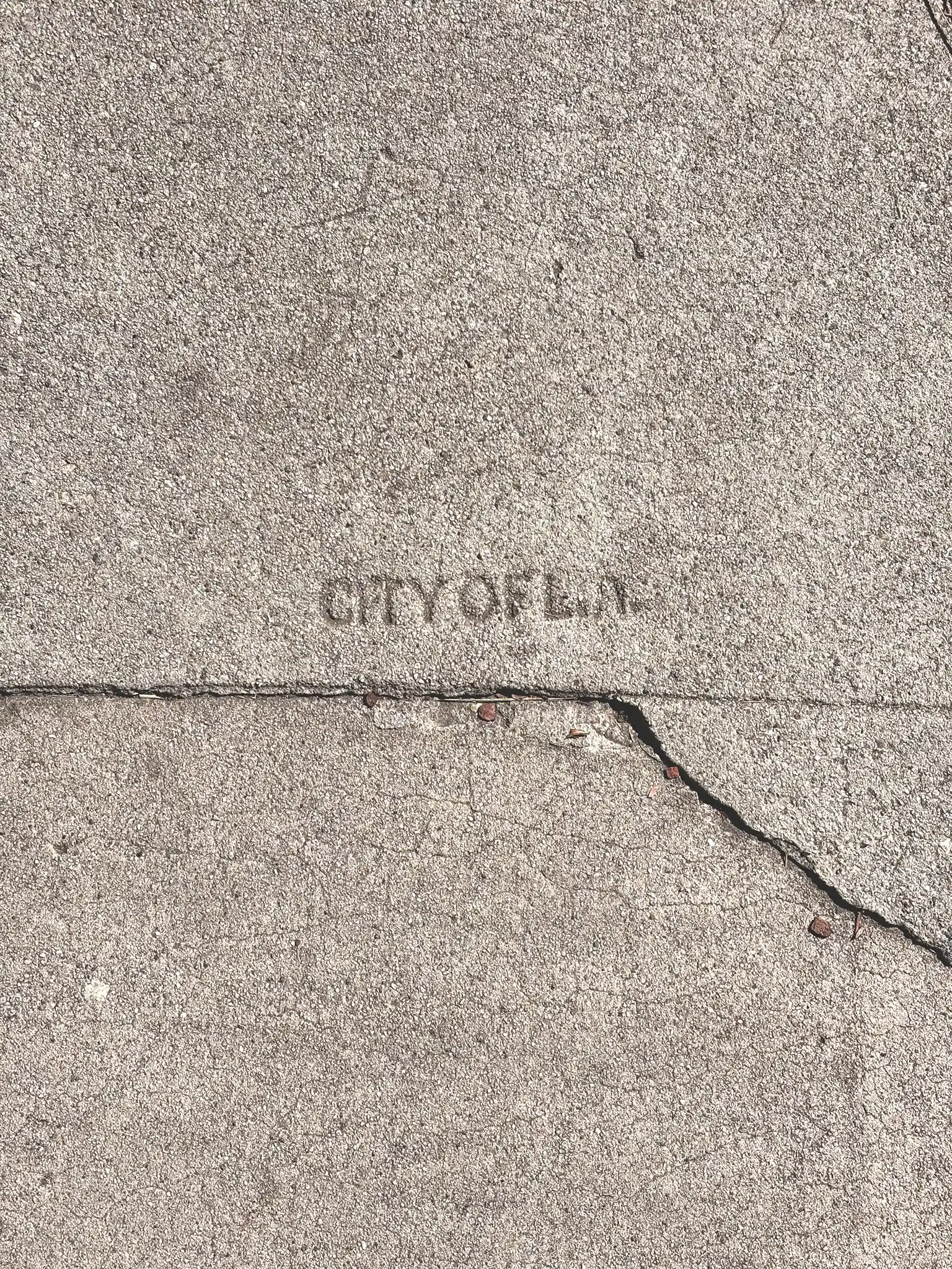 CITY OF LA quality tracking mark <br> stamped onto sidewalk slab, 1930s